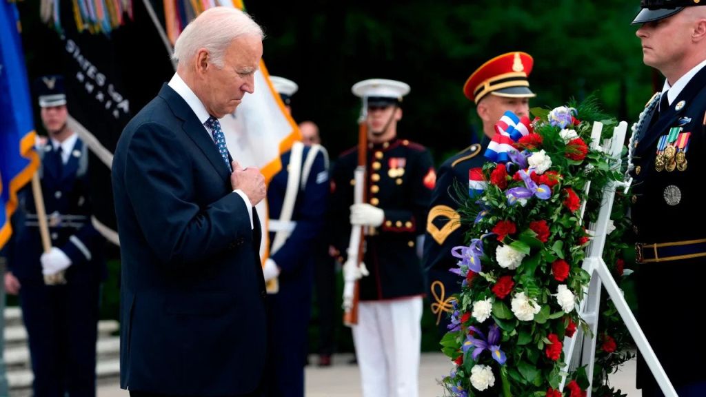 President Joe Biden pauses after laying a wreath at The Tomb 